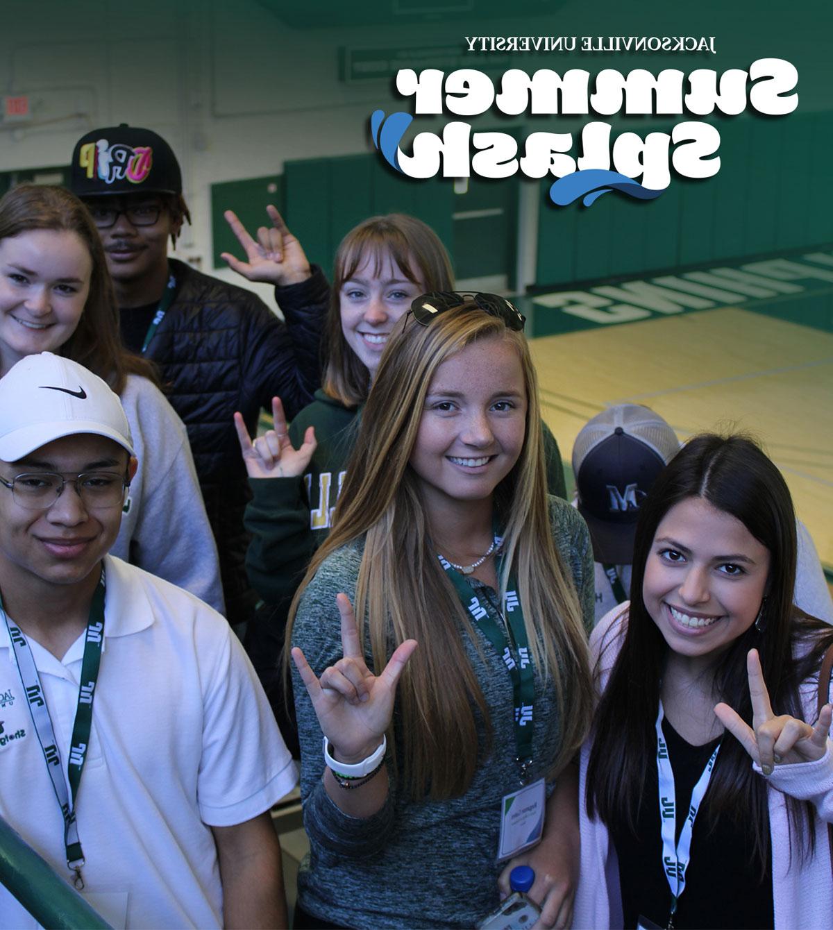 Future students posing for a photo in Historic Swisher Gymnasium.